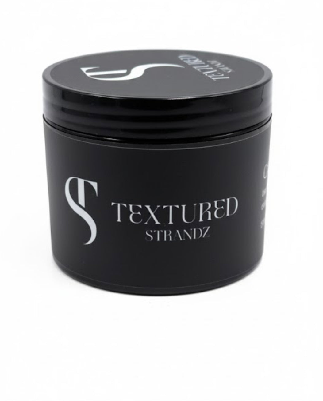 Black container with 'Textured Strandz' branding on a white background