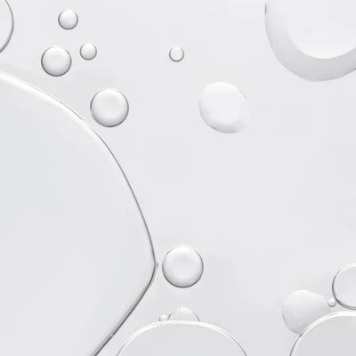Close-up of oil and water bubbles on a white background