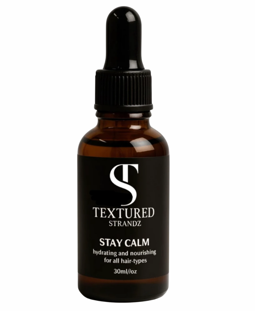 Brown bottle with dropper labeled 'Textured Strandz' on a white background