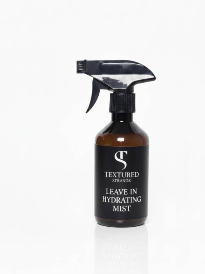 Textured Strand leave-in hydrating mist bottle on a white background