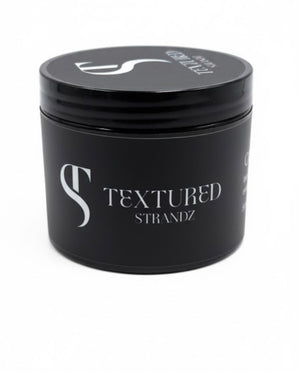 Black container with 'Textured Strandz' branding on a white background
