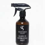 Black spray bottle labeled 'Textured Strandz Leave In Hydrating Mist' on a white background