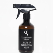 Black spray bottle labeled 'Textured Strandz Leave In Hydrating Mist' on a white background